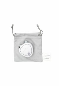 White electronic device shaped like a teardrop, with silver accents, housed in a gray drawstring pouch. Features a central button.