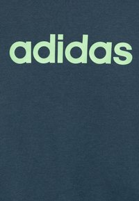 adidas Performance UNISEX SET - Pantalones - preloved ink/semi green/spark bottom/medium grey