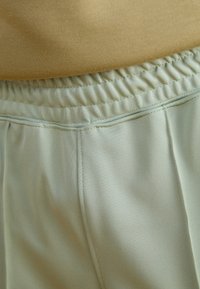 Nike Sportswear Träningsbyxor - mint