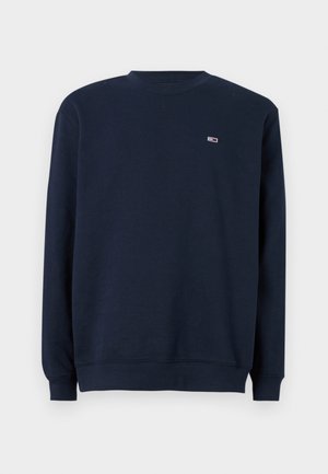 Marinblå sweatshirt lavet af bomuld, med rund halsudskæring, ribbede ærmer og et lille logo på brystet. Glat tekstur.