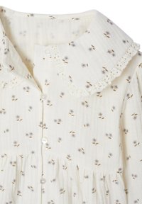 Cream-colored baby dress with small blue floral prints, lace-trimmed collar, and white buttons down the front.