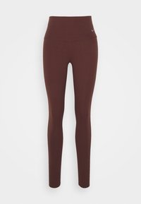 Legginsy z wysokim stanem, elastyczne, w bogatym brązowym kolorze. Gładka tekstura z dopasowanym krojem, z małym logo blisko pasa.