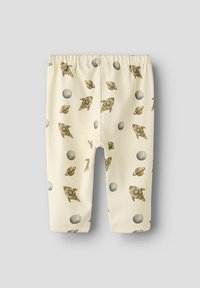 Legginsy w kolorze kremowym z powtarzającym się wzorem rakiet, planet i pierścieni, wykonane z miękkiego, elastycznego materiału z gumką w pasie.