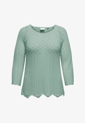 Lys grønn strikket genser med et teksturert mønster, tre kvarte ermer og bølget kant. Laget av pustende stoff.