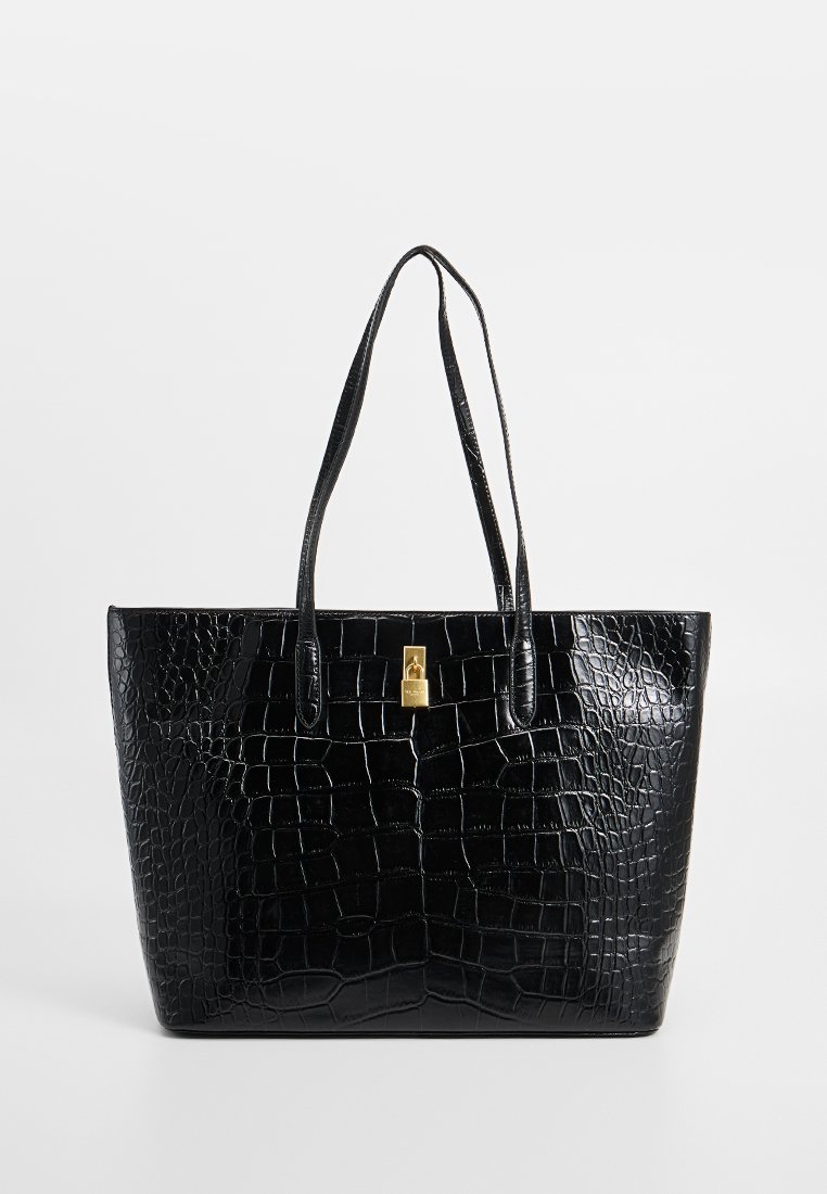 Black crocodile-embossed tote bag with glossy texture, two shoulder straps, and a gold-tone lock accent at the center of the front.
