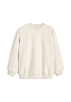 Kremowy sweatshirt z okrągłym dekoltem, opadającymi ramionami i ściągaczami. Miękka tkanina z minimalnymi szwami i bez wzorów.
