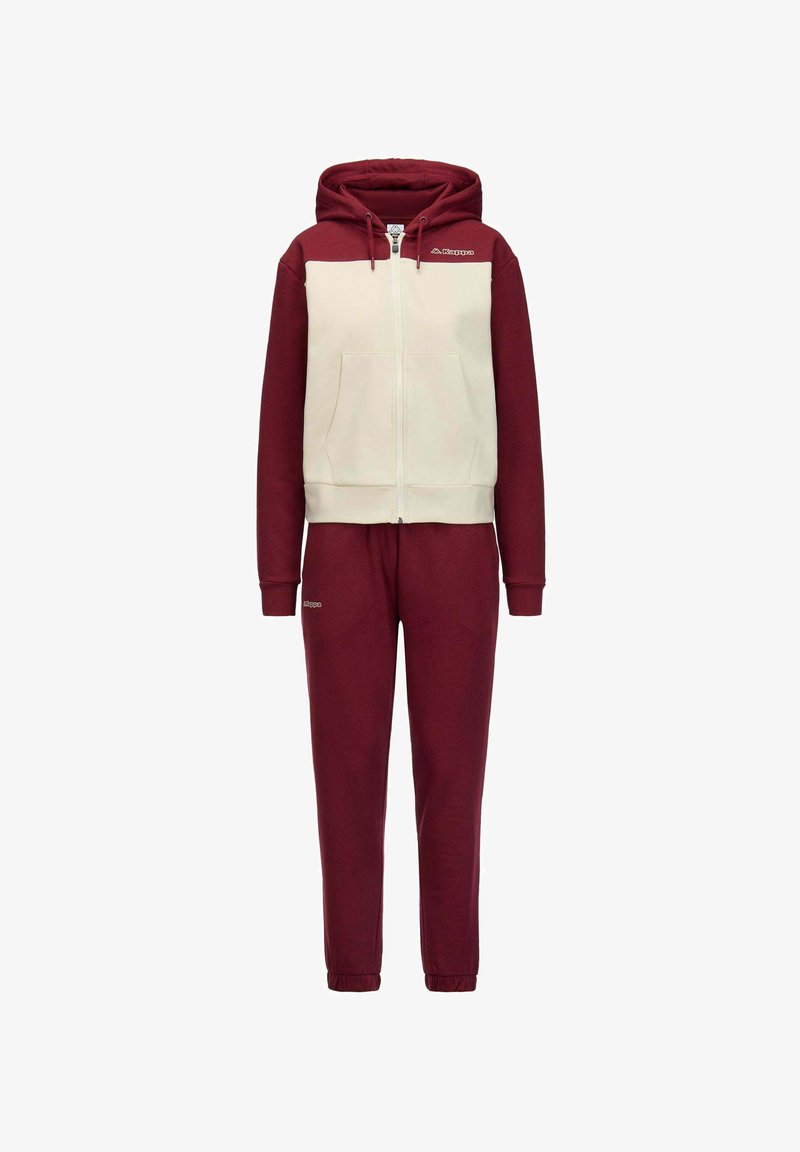 Felpa con cappuccio con zip rossa e crema, con cappuccio ampio e tasche frontali, abbinata a pantaloni della tuta rossi coordinati con polsini elasticizzati e logo.