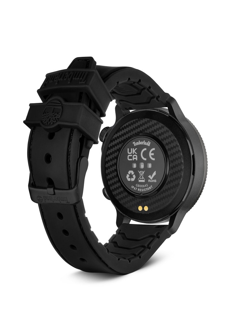 Black watch with a rubber strap, carbon fiber texture on the back, and visible technical details. IP67 water-resistant rating highlighted.