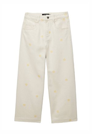 Jeans larges écru avec petits motifs de marguerites brodées en jaune, poches avant et fermeture par bouton à la taille.
