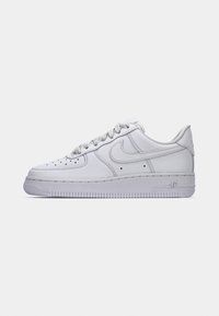 Low-top white Nike Air Force 1 sneaker with perforated toe box, stitched swoosh logo, and lace-up closure on a plain background.