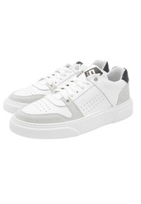 White leather sneakers with gray suede accents, perforated details, flat laces, and a textured rubber sole. Features a padded ankle and tongue.