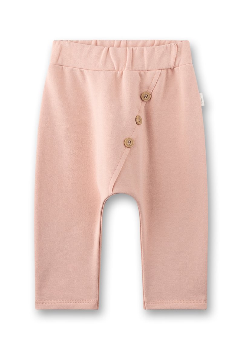 Weiche rosa Babypant mit elastischem Bund und drei braunen Knöpfen entlang einer diagonalen Naht auf der vorderen linken Seite.