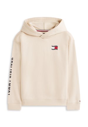 Beige hettegenser med logoemblem på brystet foran, "Tommy Hilfiger"-tekst på venstre erme, ribbestrikkede mansjetter og kant, og en hette foran med stripete innerfôr.