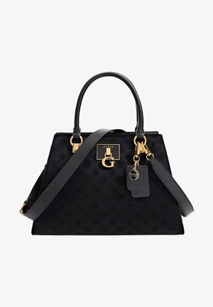 Black Guess handbag with embossed logo pattern, gold hardware, double handles, detachable shoulder strap, and branded tags.