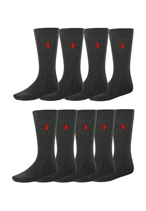 Osem tmavomodrých členkových ponožiek so žíhanými manžetami a malým červeným vyšitým logom na boku, usporiadaných do dvoch radov po štyroch.