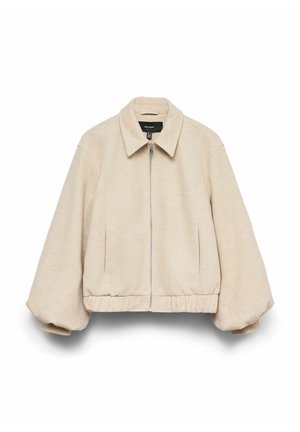 Bēša īsa jaka ar vaļēju piegriezumu, priekšā rāvējslēdzējs, platas piedurknes un smaili izgriezts apkaklis. Mīksta auduma tekstūra.