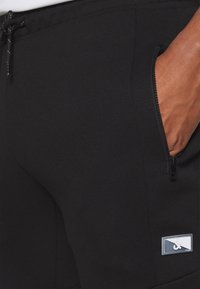 Jack & Jones JPSTWILL JJSTAPLE PANTS FB - Tréningruha alsók - black