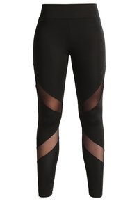 Leggings negros con paneles de malla transparente que presentan cortes geométricos a los lados. Hechos de un tejido elástico, tienen una cintura alta y una textura suave.