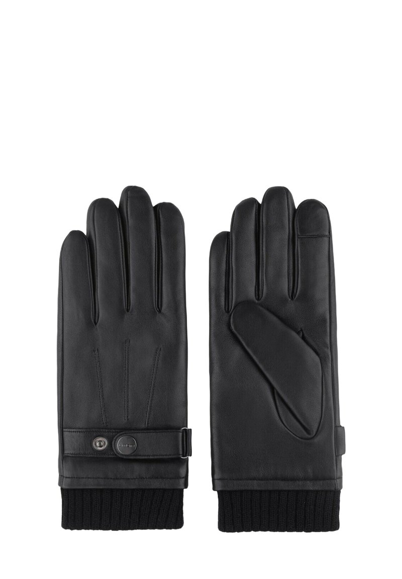 Une paire de gants en cuir noir avec des poignets en tricot côtelé et une sangle à bouton-pression sur le gant gauche, présentée à plat avec les paumes face vers le haut et vers le bas.