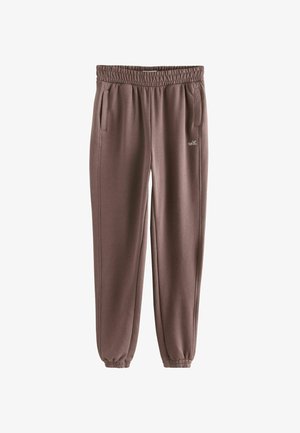 Braune Sweatpants mit elastischem Taillenbund, seitlichen Taschen und einem gerafften Bündchen am Knöchel. Mit dezentem "self." Logo-Detail.
