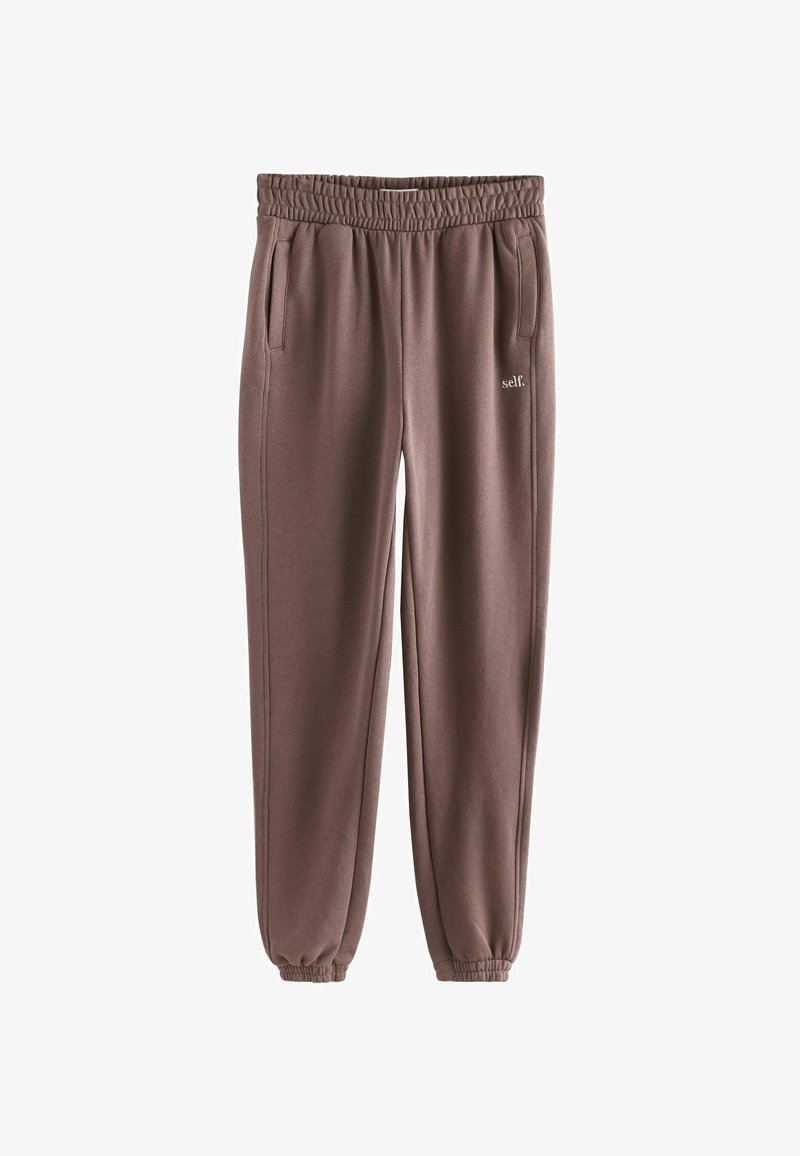 Brune sweatpants med elastisk talje, sidelommer og en samlet ribkant ved anklen. Har subtil "self." logo detalje.