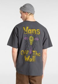 Gray cotton t-shirt featuring a colorful graphic of a skull and cross in purple and yellow on the back, with the brand name "Vans Off The Wall."