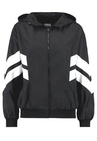 Chaqueta negra con capucha y franjas diagonales blancas en las mangas, con cierre frontal y puños elásticos. Fabricada en material ligero.