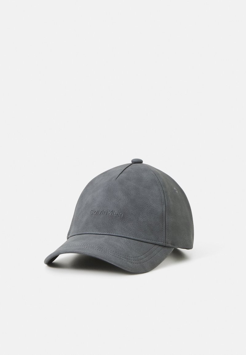 Gray faux leather cap featuring a stitched brim, rounded crown, and embossed logo on the front for brand identification.