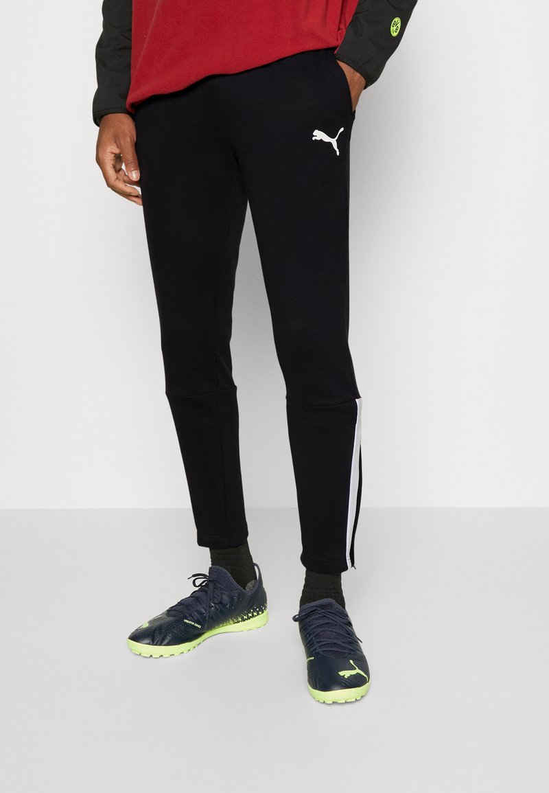 Puma INDIVIDUALLIGA CASUALS PANTS Tracksuit bottoms black Zalando.co.uk