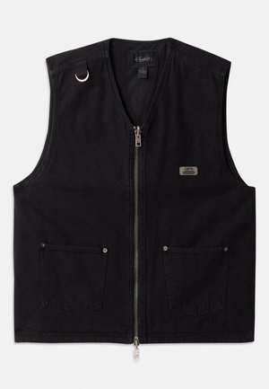 Black sleeveless vest made of denim with a front zipper, two front pockets, and metal hardware accents. Features a brand label on the chest.
