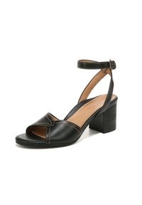 Zwarte lederen sandaal met open teen, gekruiste banden, verstelbare enkelband en een gestructureerde zwarte blokhak. Beschikt over contrasterende stiksels.