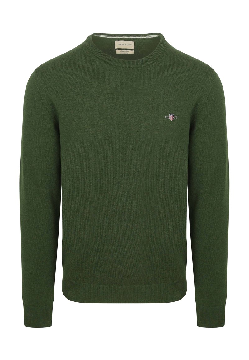 Donkergroene trui met ronde hals, gebreide structuur, lange mouwen, geribbelde manchetten en zoom, klein geborduurd logo op de borst.