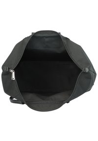 Black fabric bag with a wide opening, zipper closure, and a smooth interior. Features sturdy handles and a minimalist design.
