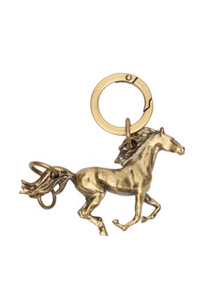 Mosiężny breloczek w kształcie galopującego konia z detaliczną grzywą i ogonem, przymocowany do okrągłego mosiężnego kółka na klucze.
