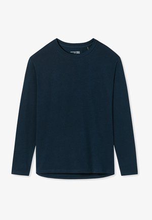 Chemise à manches longues en bleu marine foncé, en coton doux, avec un col rond et un ourlet droit légèrement plus long à l'arrière.