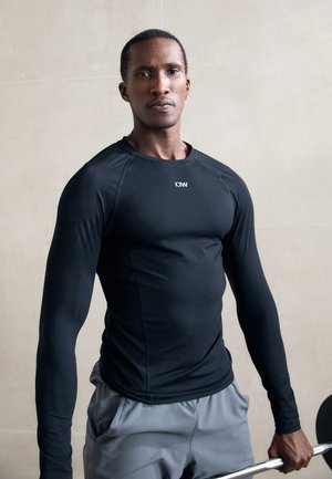 IGNITE MUSCLE FIT LONG SLEEVE - Ilgarankovis viršutinės dalies drabužis - black