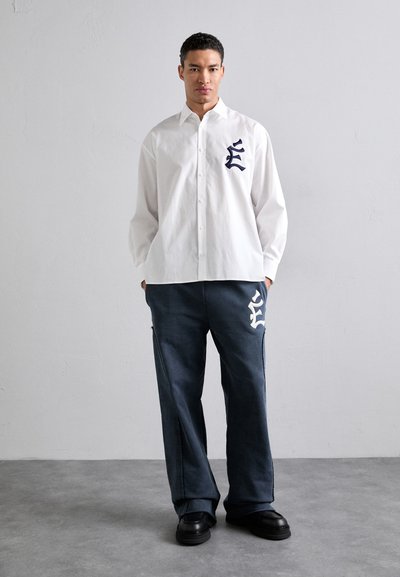 Études PANT EMBROIDERED - Tracksuit bottoms - navy
