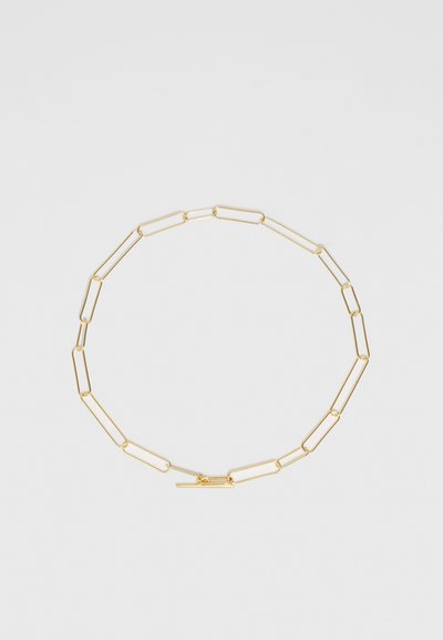 Gold chain necklace with elongated, paperclip-style links and a simple clasp. Smooth texture with a polished finish.