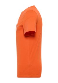 Orange cotton t-shirt with short sleeves, round neckline, and a visible logo printed on the front. Simple, straight-cut design.