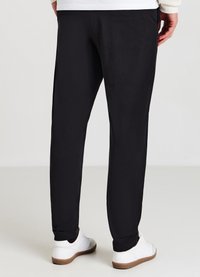 Calliope GINNICI CON POLSINI - Jogginghose - nero