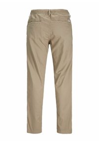 Beiget kapeat housut, joissa on joustava vyötärönauha, kaksi takataskua ja hienovarainen logodetalji sivulla. Sileä puuvillakangas.