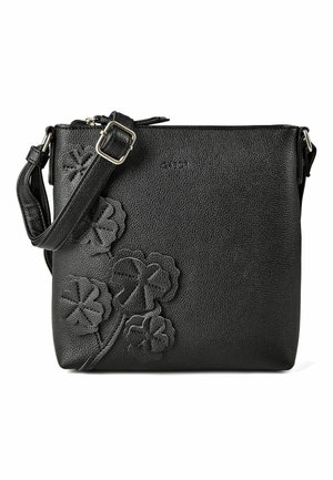 Sac bandoulière en cuir noir avec sangle réglable et appliques florales embossées sur le devant.