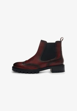 Burgundy leather Chelsea boot with black elastic side panels, detailed brogue pattern, and chunky rubber sole for traction.