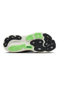 Suela de zapato con goma negra y detalles en verde, patrones texturizados y una base blanca. Logo de la marca visible.