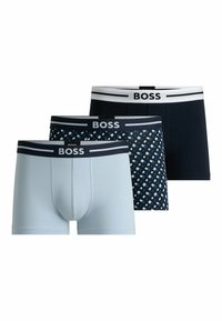 Three pairs of men's boxer shorts: light blue, dark navy, and patterned navy with light blue accents. All feature a white “BOSS” branded waistband.