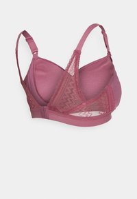Mauve-BH mit Spitzendetails, nahtlosen Cups, verstellbaren Trägern und elastischem Band. Besitzt ein geometrisches Muster auf der Spitze.