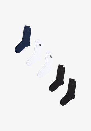 Set treh par soknov: eno mornarsko modro, dve beli in dve črni. Vsak par ima majhen logo blizu vrha. Mešanica bombaža, dolžina do sredine teleta.