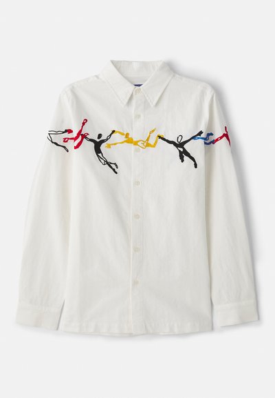 White long-sleeve shirt featuring colorful embroidered figures in red, blue, yellow, and black, with a classic collar and button-down front.