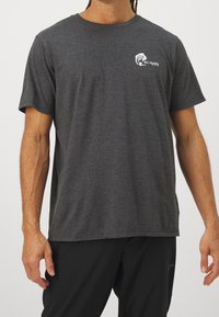 Gray short-sleeve t-shirt made of soft fabric, featuring a small white logo on the chest and a relaxed fit. Smooth texture with standard crew neck.