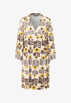 Langärmeliges Wickelkleid mit Kragen, mit gelben und braunen Blumen- und Blattmustern auf cremefarbenem Hintergrund, in der Taille gebunden.